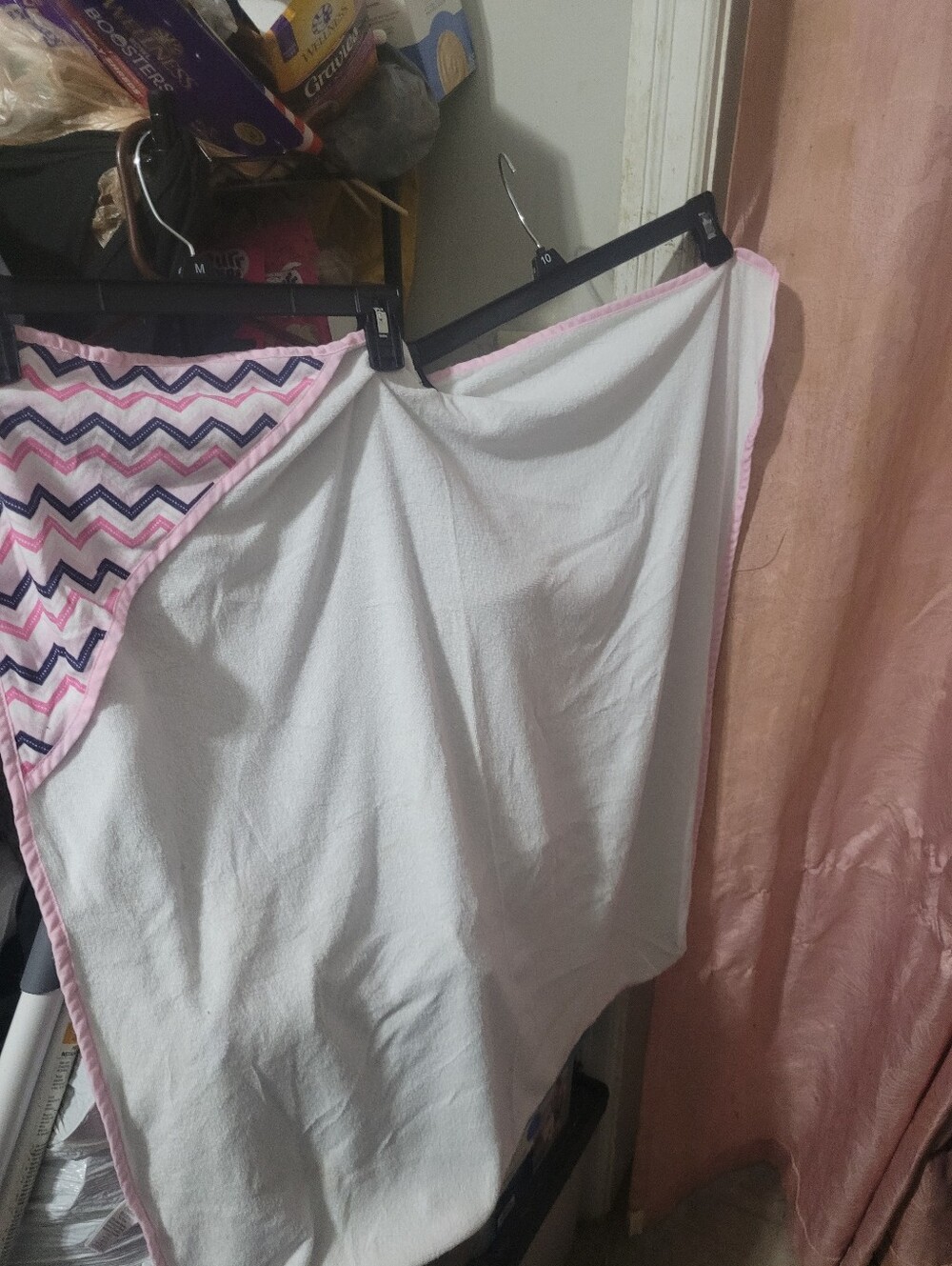 Luvable Friends'; appears to be a baby/toddler blanket or cloth with pink bindin